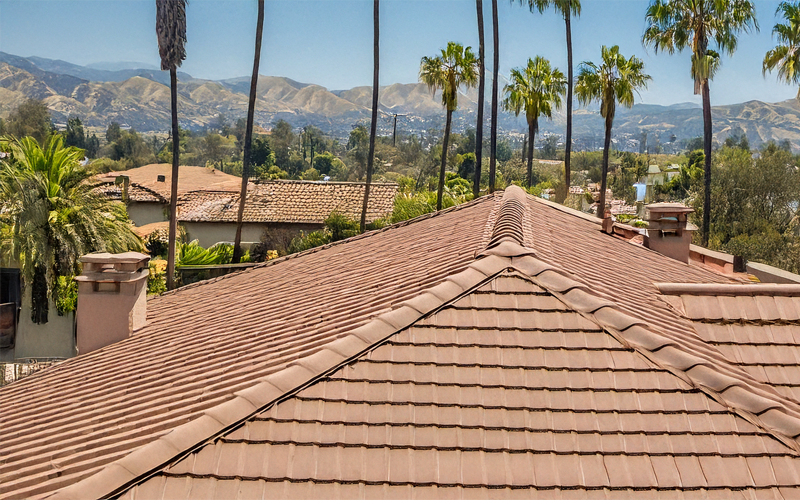 roof of house in southern California with hills in the background