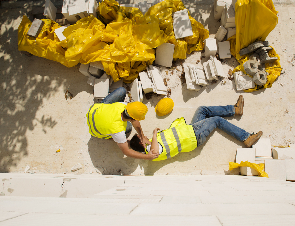 workmen fallen over with broken building materials